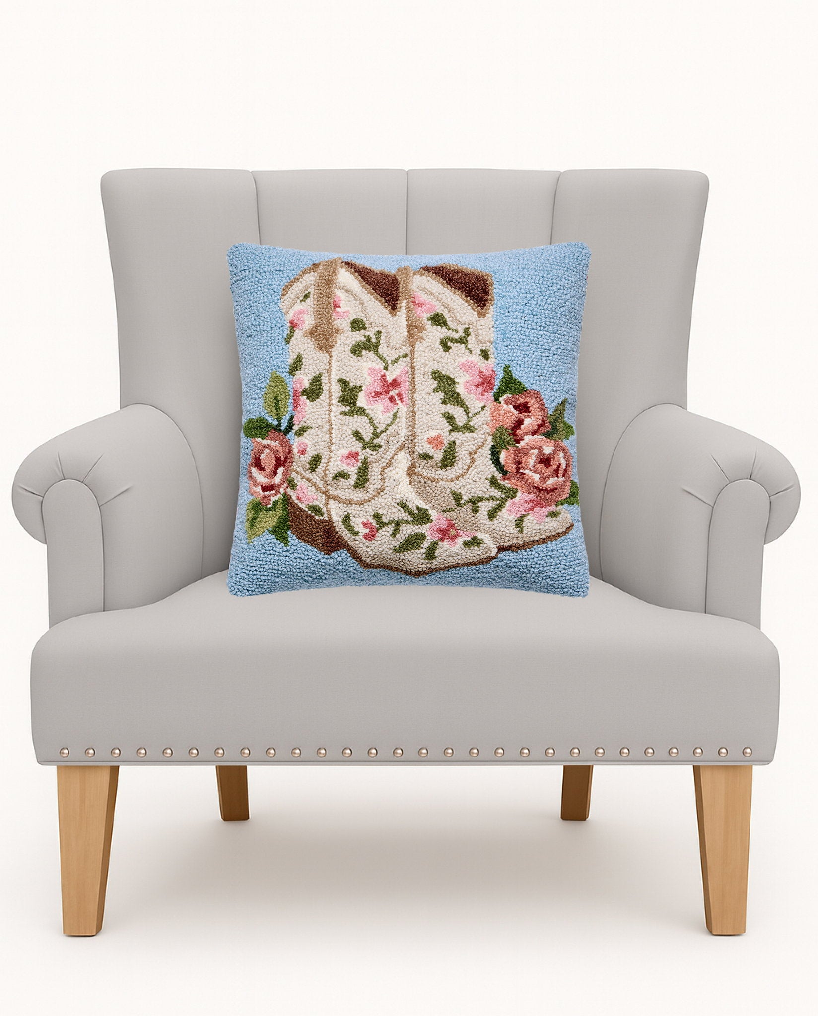 Floral Cowgirl Boots Hooked Wool Throw Pillow on an armchair, showing the throw pillow at room scale, 16x16 inch