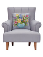 Floral Egg Hooked Wool Easter Throw Pillow on an armchair, showing the throw pillow at room scale, 16x16 inch