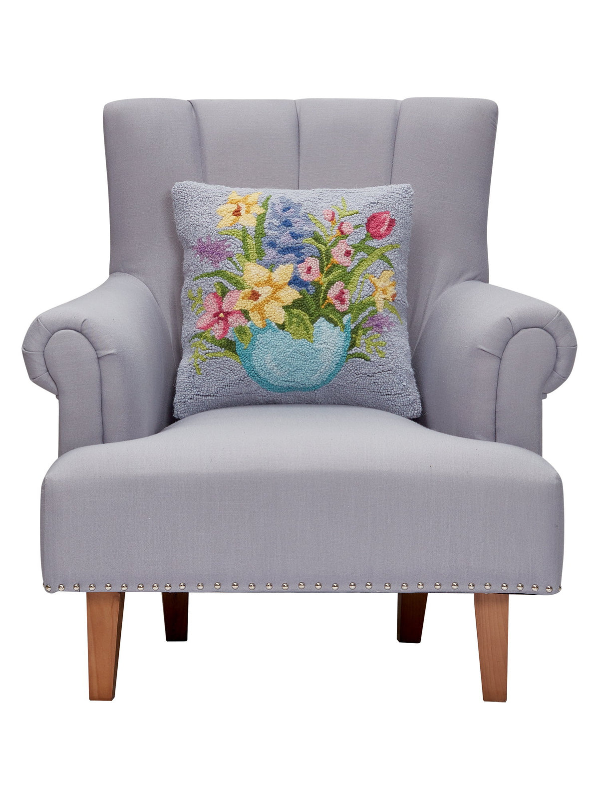 Floral Egg Hooked Wool Easter Throw Pillow on an armchair, showing the throw pillow at room scale, 16x16 inch
