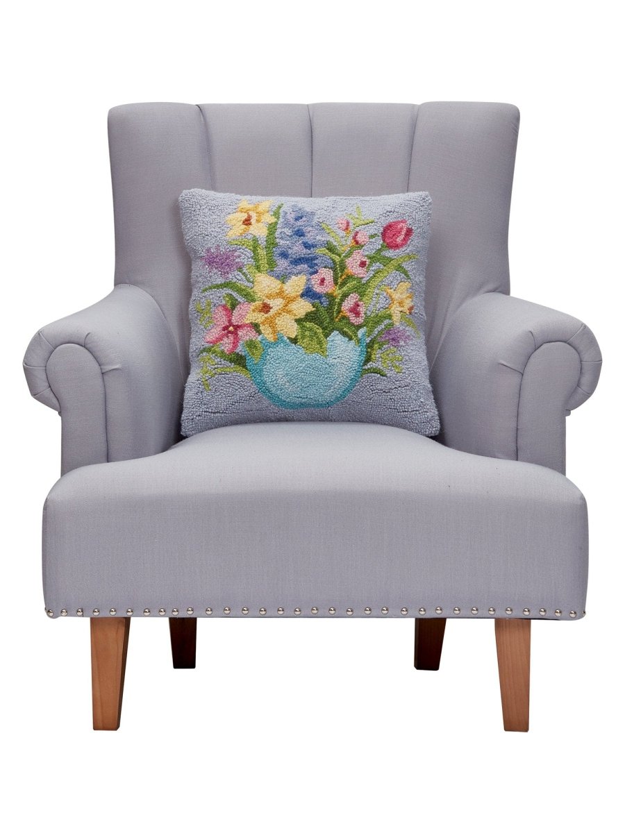 Floral Egg Hooked Wool Easter Throw Pillow on an armchair, showing the throw pillow at room scale, 16x16 inch