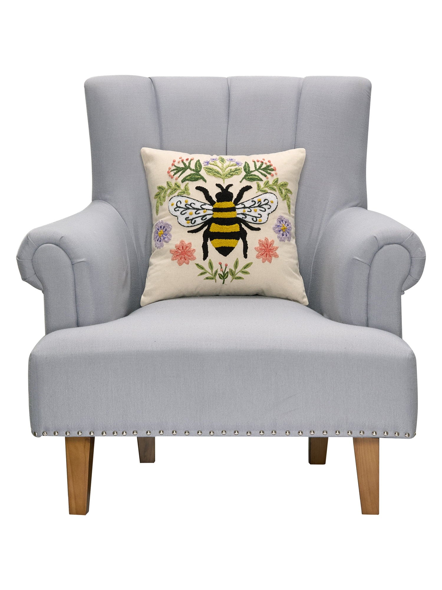 Floral Natural Bee Embroidered Throw Pillow on an armchair, showing the throw pillow at room scale, 16x16 inch