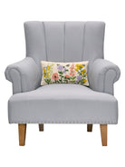 Floral Natural Field Embroidered Throw Pillow on an armchair, showing the throw pillow at room scale, 9x16 inch