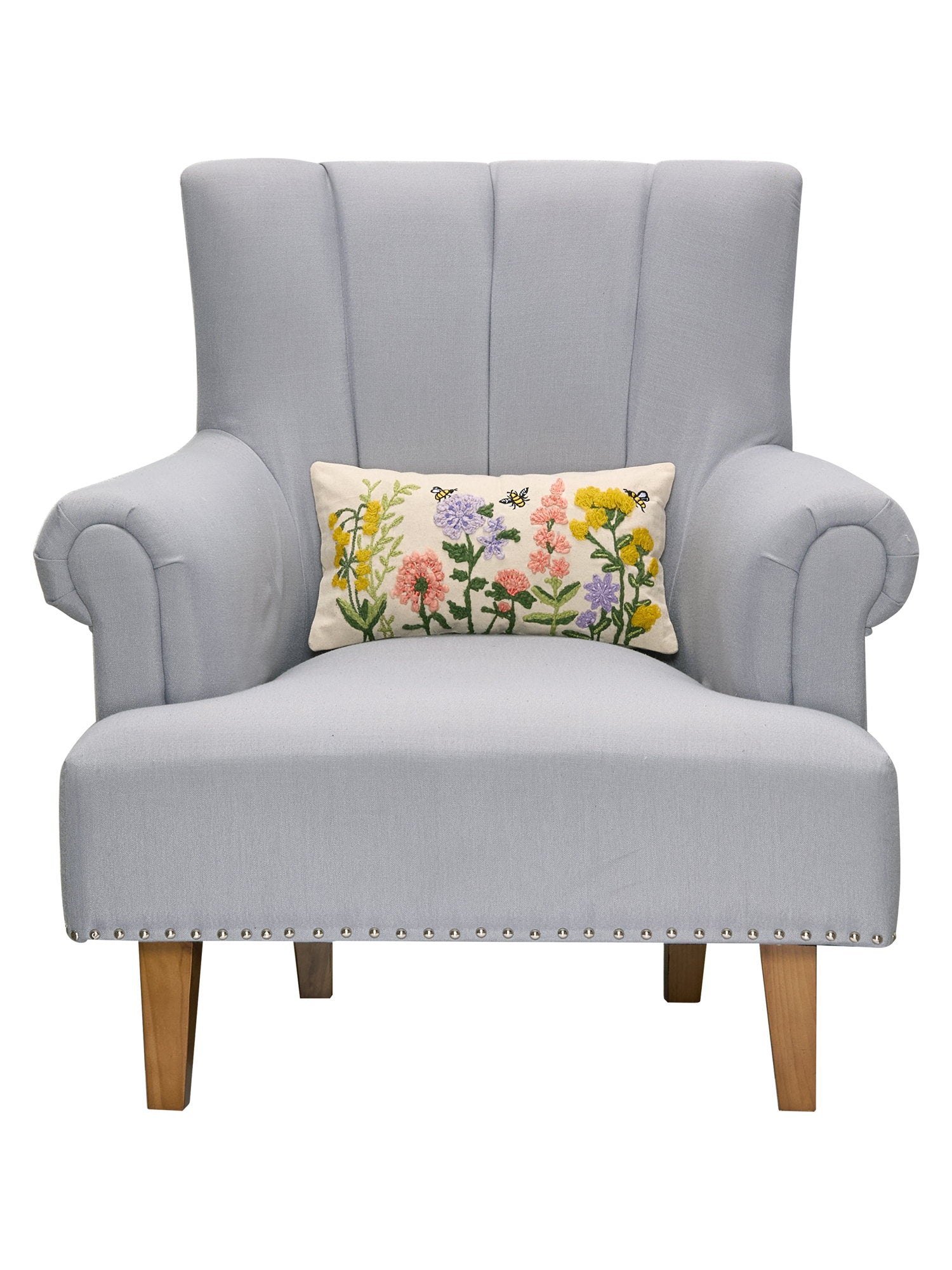 Floral Natural Field Embroidered Throw Pillow on an armchair, showing the throw pillow at room scale, 9x16 inch