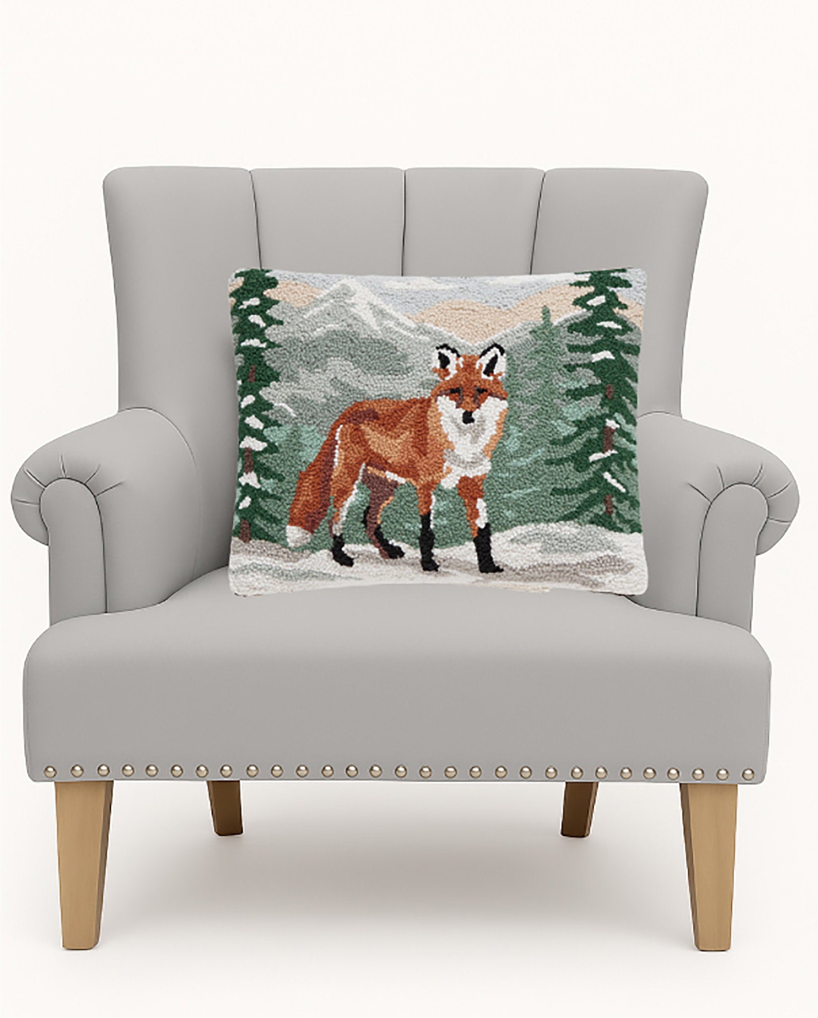 Forest Fox Hooked Wool Throw Pillow on an armchair, showing the throw pillow at room scale, 14x18 inch