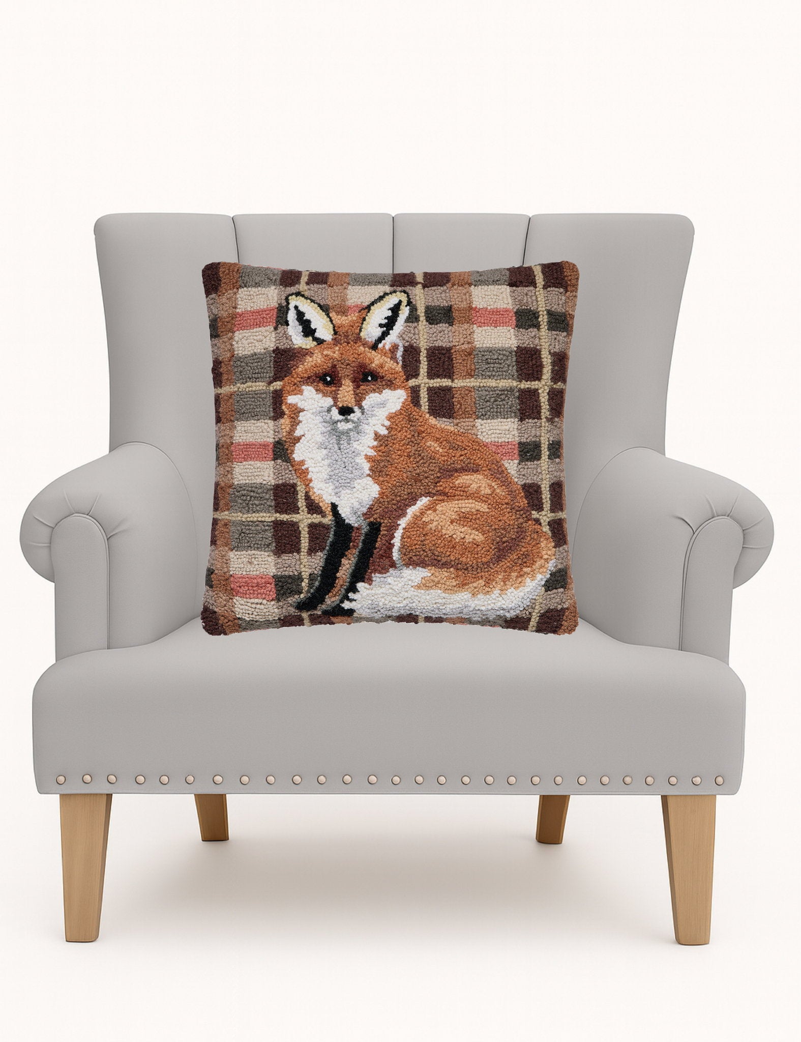 Fox Tartan Hooked Wool Throw Pillow on an armchair, showing the throw pillow at room scale, 18x18 inch