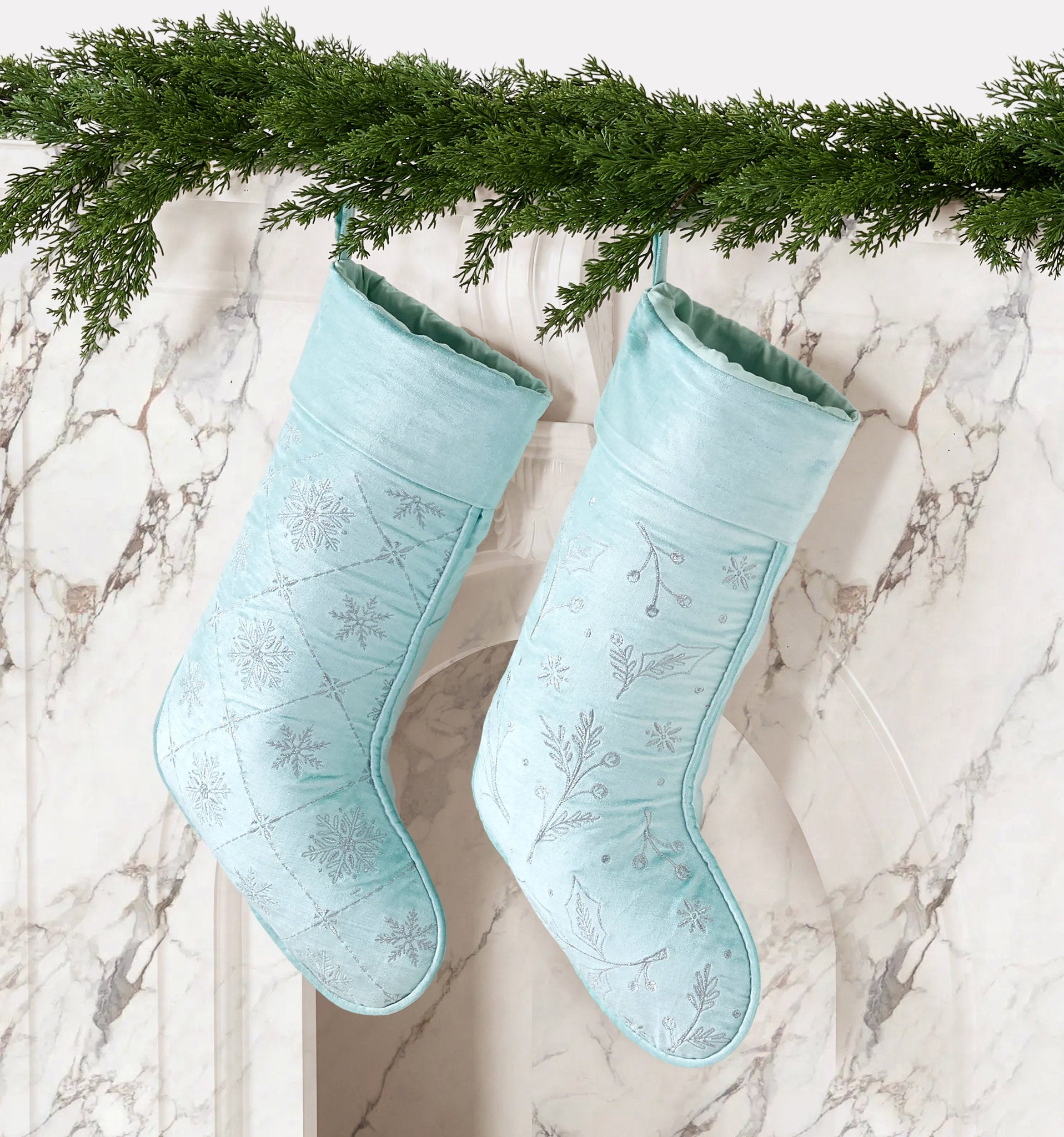 Frosty Blue Snowflake Embroidered Christmas Stocking styled in a room setting, 12x20 inch