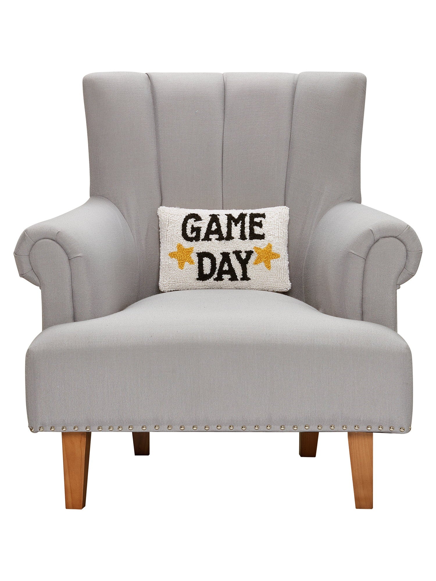 Game Day Hooked Wool Throw Pillow on an armchair, showing the throw pillow at room scale, 8x12 inch