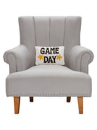 Game Day Hooked Wool Throw Pillow on an armchair, showing the throw pillow at room scale, 8x12 inch