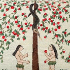 Closeup of Garden of Eden Apple needlepoint throw pillow highlighting hand-stitched wool craftsmanship and fabric detail
