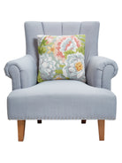 Garden Party Hooked Wool Throw Pillow on an armchair, showing the throw pillow at room scale, 18x18 inch