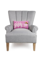Giddy Up Hat Hooked Wool Throw Pillow on an armchair, showing the throw pillow at room scale, 9x16 inch