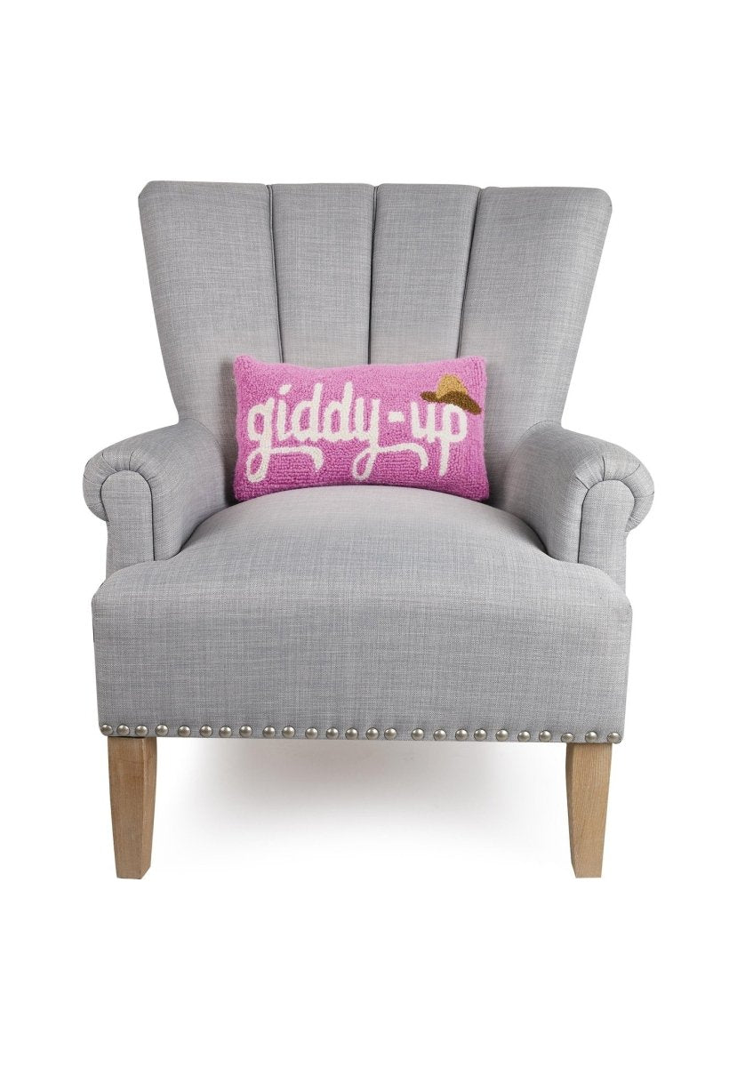 Giddy Up Hat Hooked Wool Throw Pillow on an armchair, showing the throw pillow at room scale, 9x16 inch