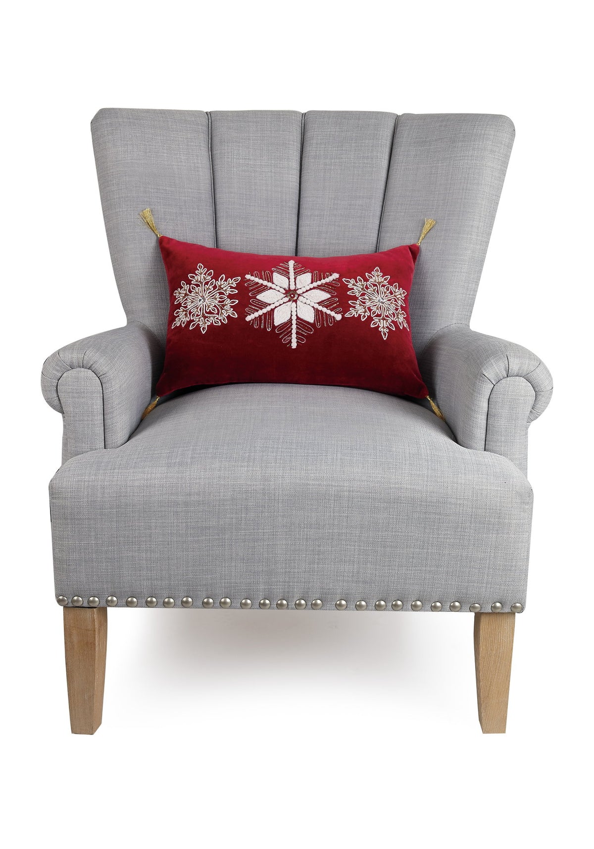 Gilded Snowflakes Embroidered Christmas Throw Pillow on an armchair, showing the throw pillow at room scale, 12x18 inch