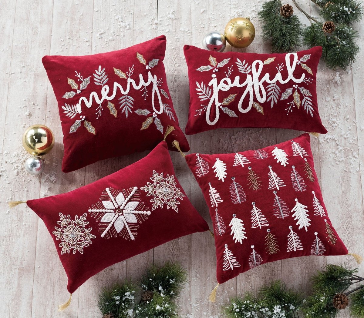 Gilded Trees Embroidered Christmas Throw Pillow shown alongside other designs in the same collection, 16x16 inch