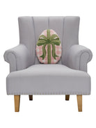 Gingham Easter Egg Hooked Wool Throw Pillow on an armchair, showing the throw pillow at room scale, 12x16 inch