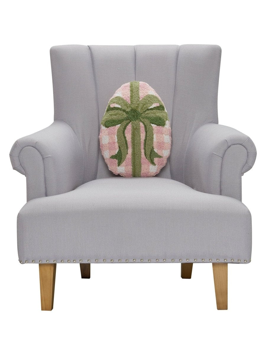 Gingham Easter Egg Hooked Wool Throw Pillow on an armchair, showing the throw pillow at room scale, 12x16 inch