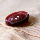 Glacier National Park Majestic Peaks Embroidered Pillow - detail of decorative button closure