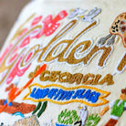 Golden Isles Coastal Embroidered Travel Throw Pillow - close-up detail of hand-embroidered needlepoint stitching