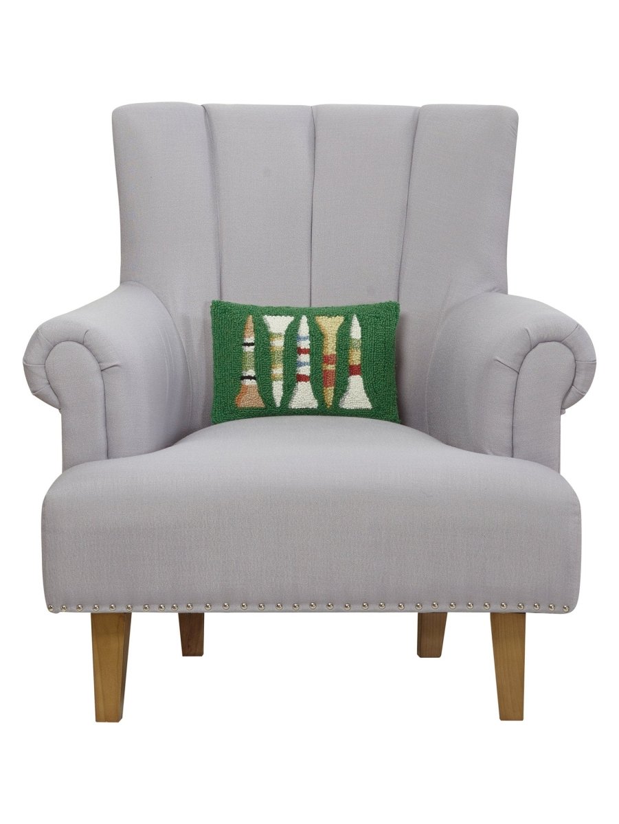 Golf Tees Hooked Wool Christmas Throw Pillow on an armchair, showing the throw pillow at room scale, 8x12 inch