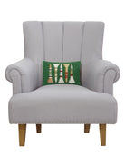Golf Tees Hooked Wool Christmas Throw Pillow on an armchair, showing the throw pillow at room scale, 8x12 inch