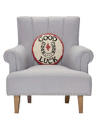 Good Luck Hooked Wool Throw Pillow on an armchair, showing the throw pillow at room scale, 14x14 inch