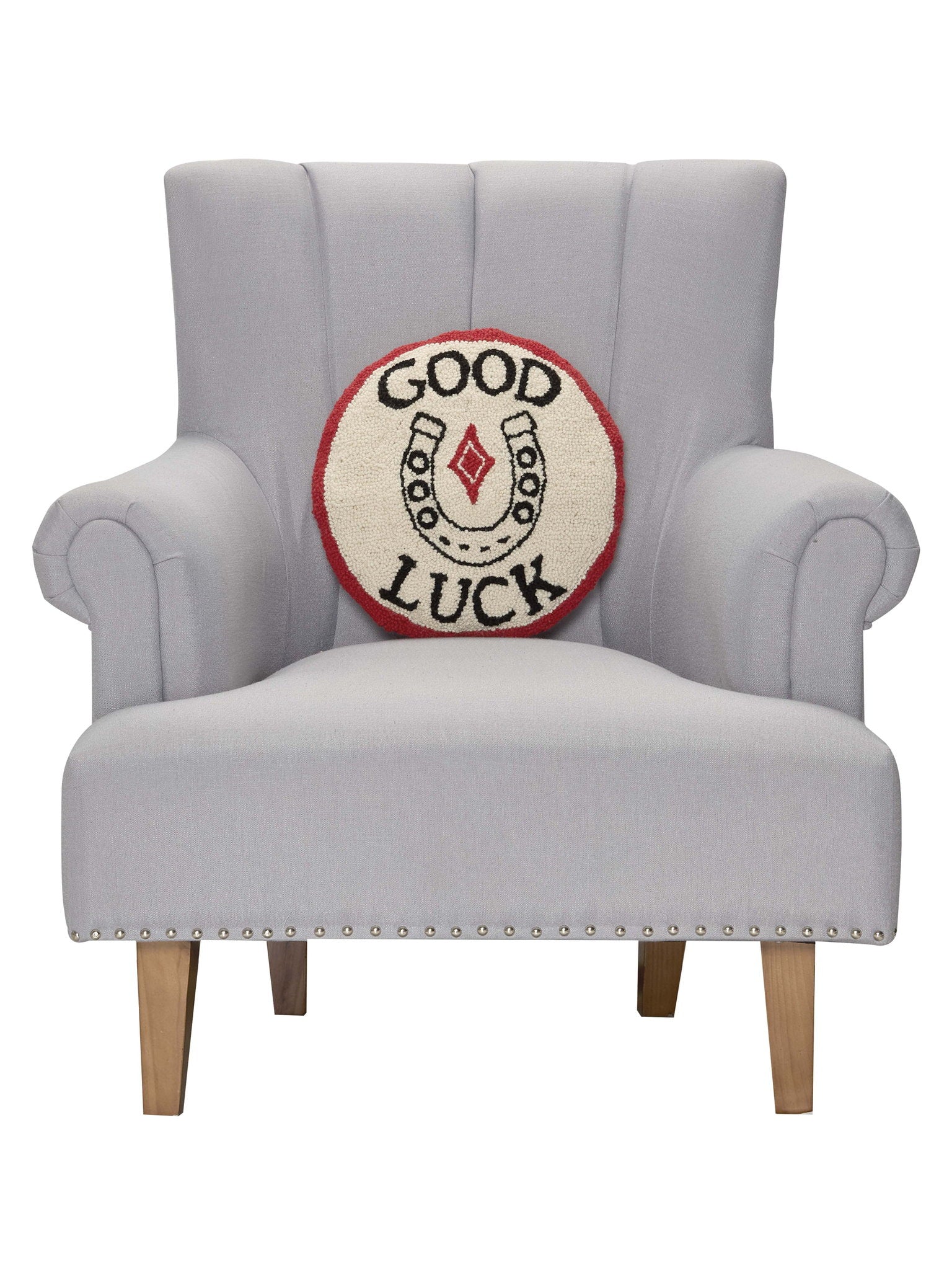 Good Luck Hooked Wool Throw Pillow on an armchair, showing the throw pillow at room scale, 14x14 inch