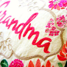Grandma Love Gift Embroidered Throw Pillow - close-up detail of hand-embroidered needlepoint stitching