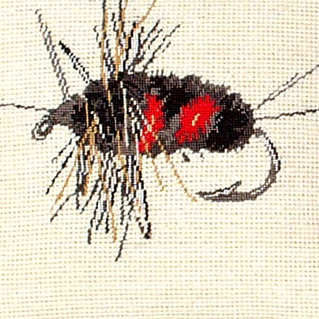 Closeup of Gray Creek Fly Fishing Wildlife needlepoint throw pillow highlighting hand-stitched wool craftsmanship and fabric detail