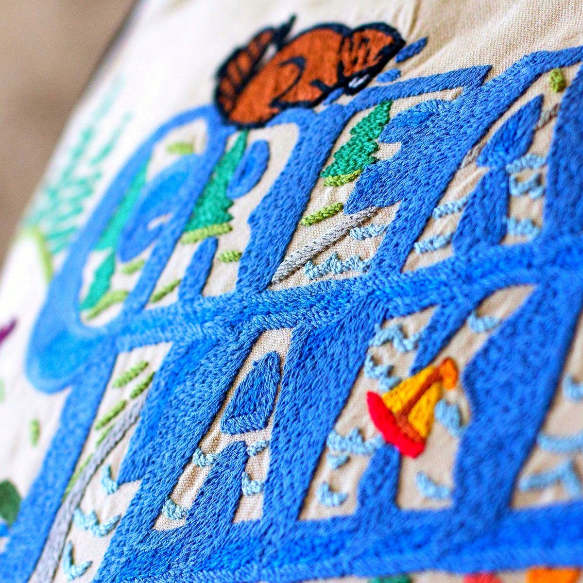 Great Lakes Nautical Charm Embroidered Throw Pillow - close-up detail of hand-embroidered needlepoint stitching