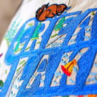 Great Lakes Nautical Charm Embroidered Throw Pillow - close-up detail of hand-embroidered needlepoint stitching