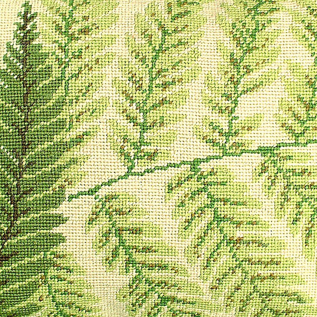 Closeup of Green Boston Fern needlepoint throw pillow highlighting hand-stitched wool craftsmanship and fabric detail