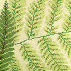 Closeup of Green Boston Fern needlepoint throw pillow highlighting hand-stitched wool craftsmanship and fabric detail