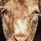 Closeup of Green Pasture Bull With Horns needlepoint throw pillow highlighting hand-stitched wool craftsmanship and fabric detail