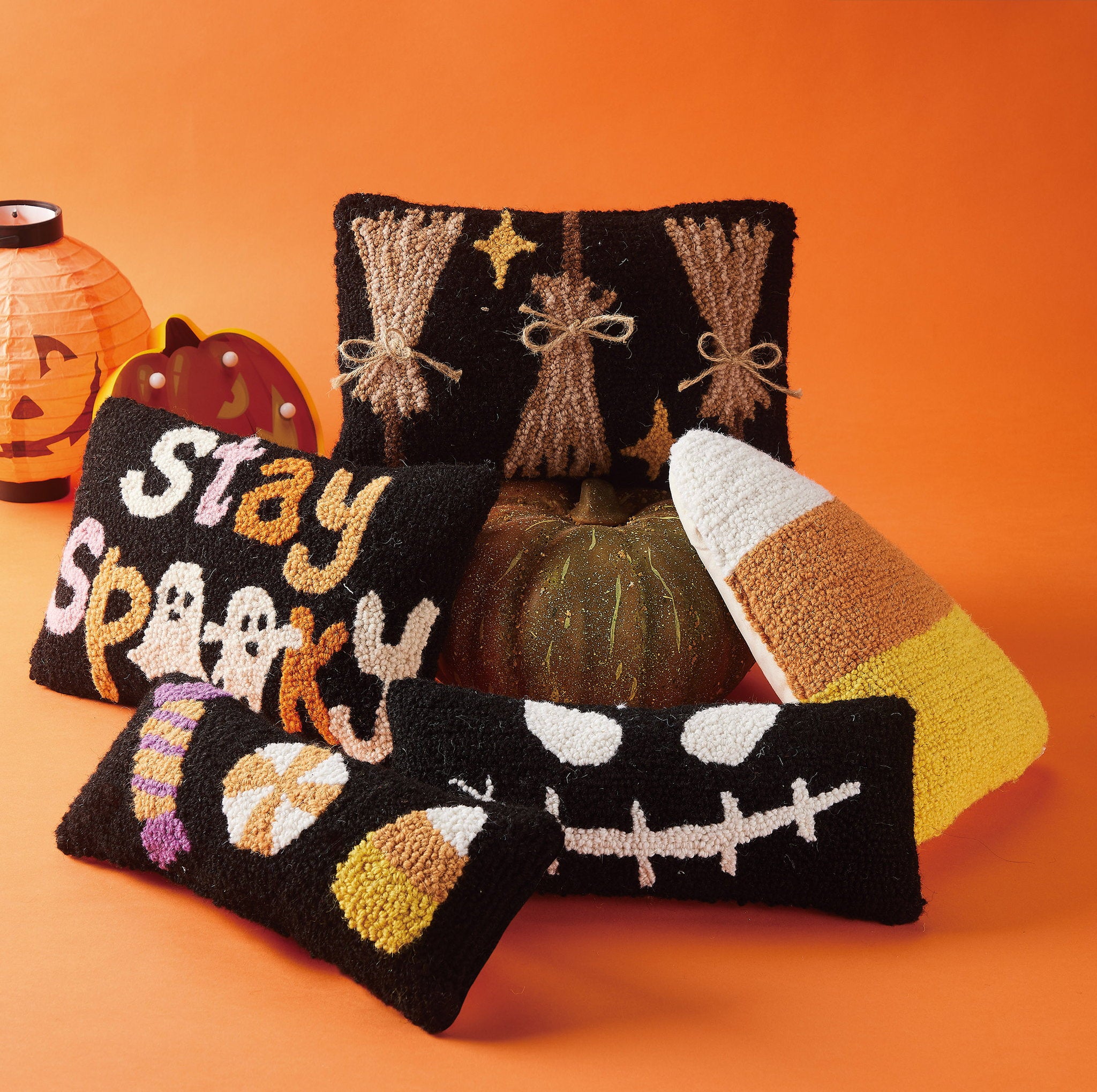 Halloween Candies Trio Hooked Wool Throw Pillow shown alongside other designs in the same collection, 12x5 inch