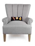 Halloween Candies Trio Hooked Wool Throw Pillow on an armchair, showing the throw pillow at room scale, 12x5 inch