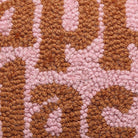 Closeup of Happy Place Hooked Wool Throw Pillow showing stitch texture and craftsmanship detail