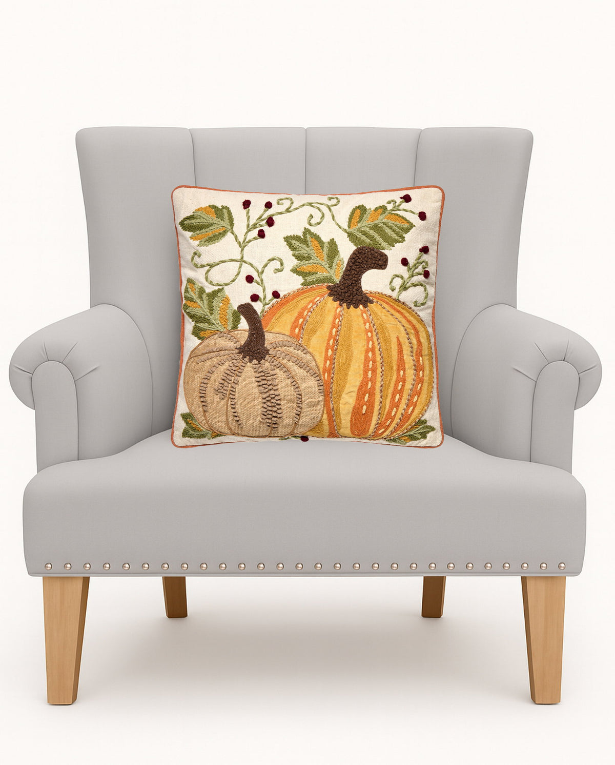 Harvest Pumpkin Duo Embroidered Fall Harvest Throw Pillow on an armchair, showing the throw pillow at room scale, 16x16 inch