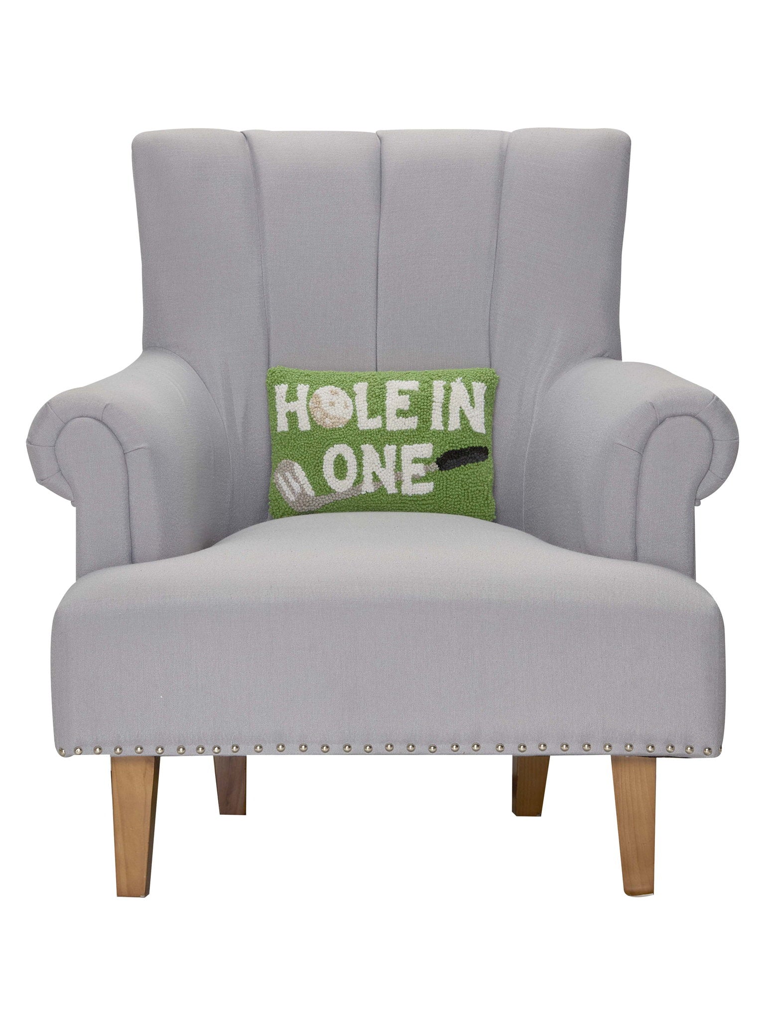 Hole in One Hooked Wool Throw Pillow on an armchair, showing the throw pillow at room scale, 8x12 inch
