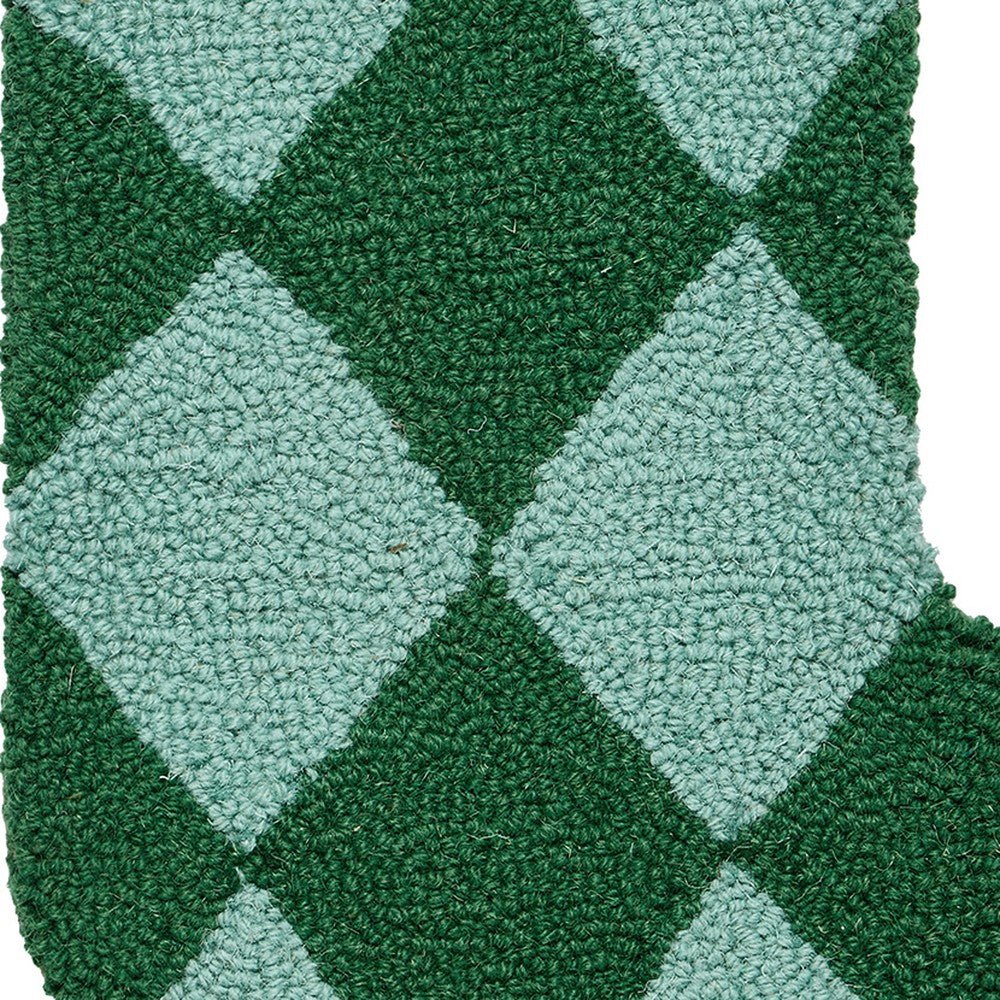 Closeup of Holiday Argyle Green with Tassel Hooked Wool Christmas Stocking showing stitch texture and craftsmanship detail