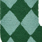 Closeup of Holiday Argyle Green with Tassel Hooked Wool Christmas Stocking showing stitch texture and craftsmanship detail