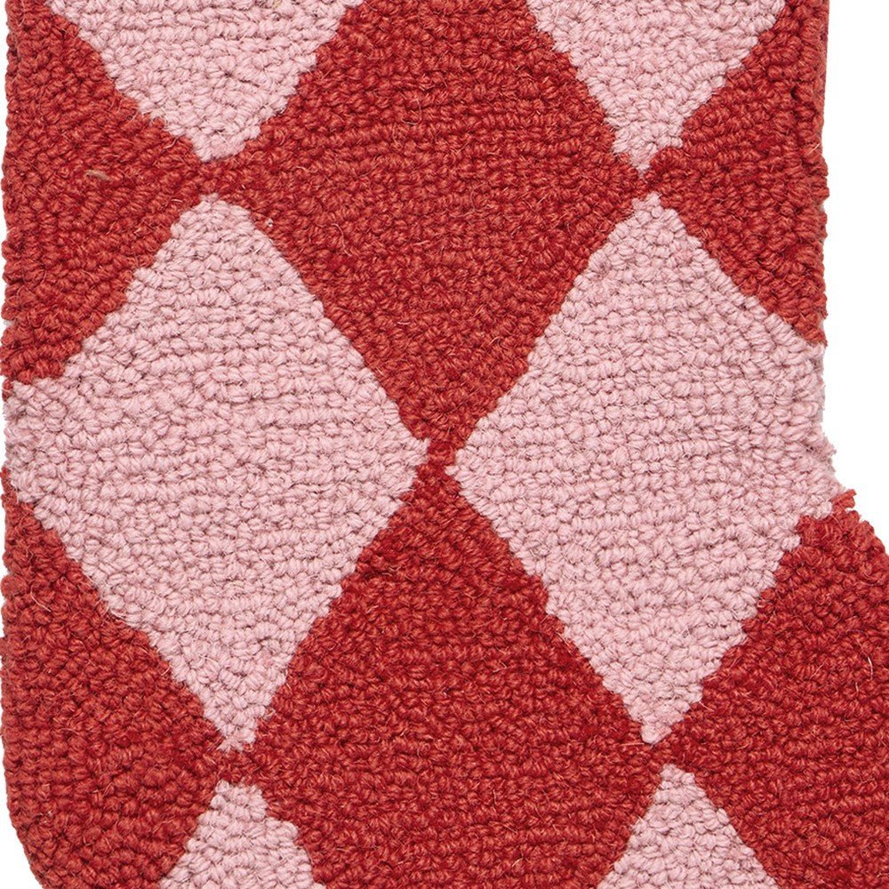 Closeup of Holiday Argyle Red with Tassel Hooked Wool Christmas Stocking showing stitch texture and craftsmanship detail