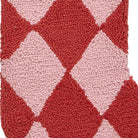 Closeup of Holiday Argyle Red with Tassel Hooked Wool Christmas Stocking showing stitch texture and craftsmanship detail