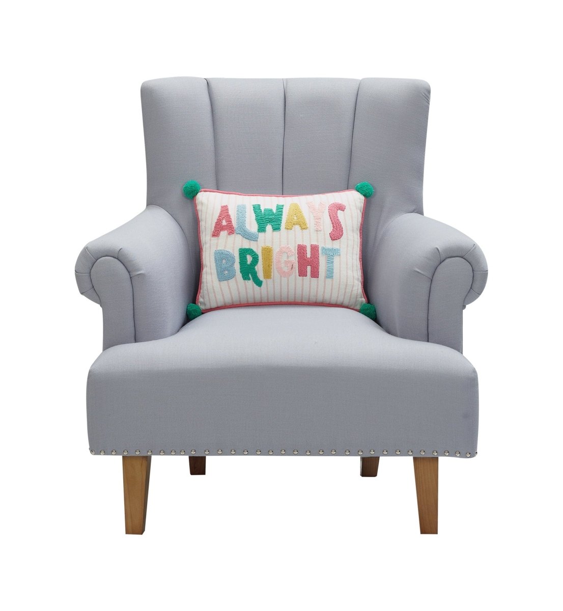 Holiday Bright's Always with Pom Poms Embroidered Throw Pillow, 12x16 inch, lettered lumbar pillow on a gray armchair