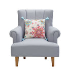 Holiday Bright's Snowflake with Tassels Embroidered Throw Pillow, 16x16 inch, snowflake design on a gray armchair