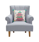 Holiday Bright's Tree with Pom Poms Embroidered Christmas Throw Pillow, 16x16 inch, tree design on a gray armchair
