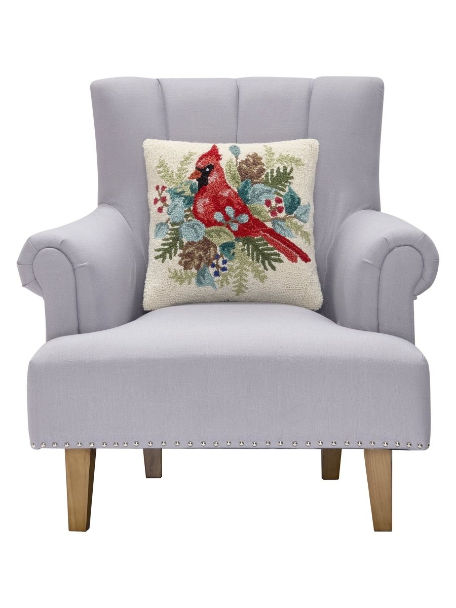 Holiday Cardinal Hooked Wool Throw Pillow on an armchair, showing the throw pillow at room scale, 16x16 inch