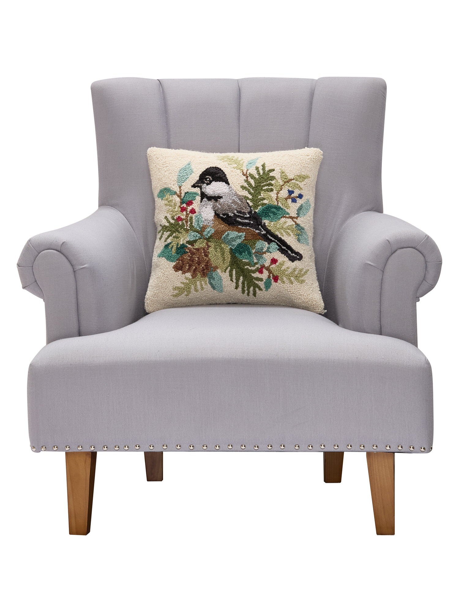 Holiday Chickadee Hooked Wool Throw Pillow on an armchair, showing the throw pillow at room scale, 16x16 inch