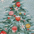 Closeup of Holiday Christmas Tree Hooked Wool Stocking showing stitch texture and craftsmanship detail