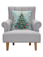 Holiday Christmas Tree Hooked Wool Throw Pillow on an armchair, showing the throw pillow at room scale, 18x18 inch