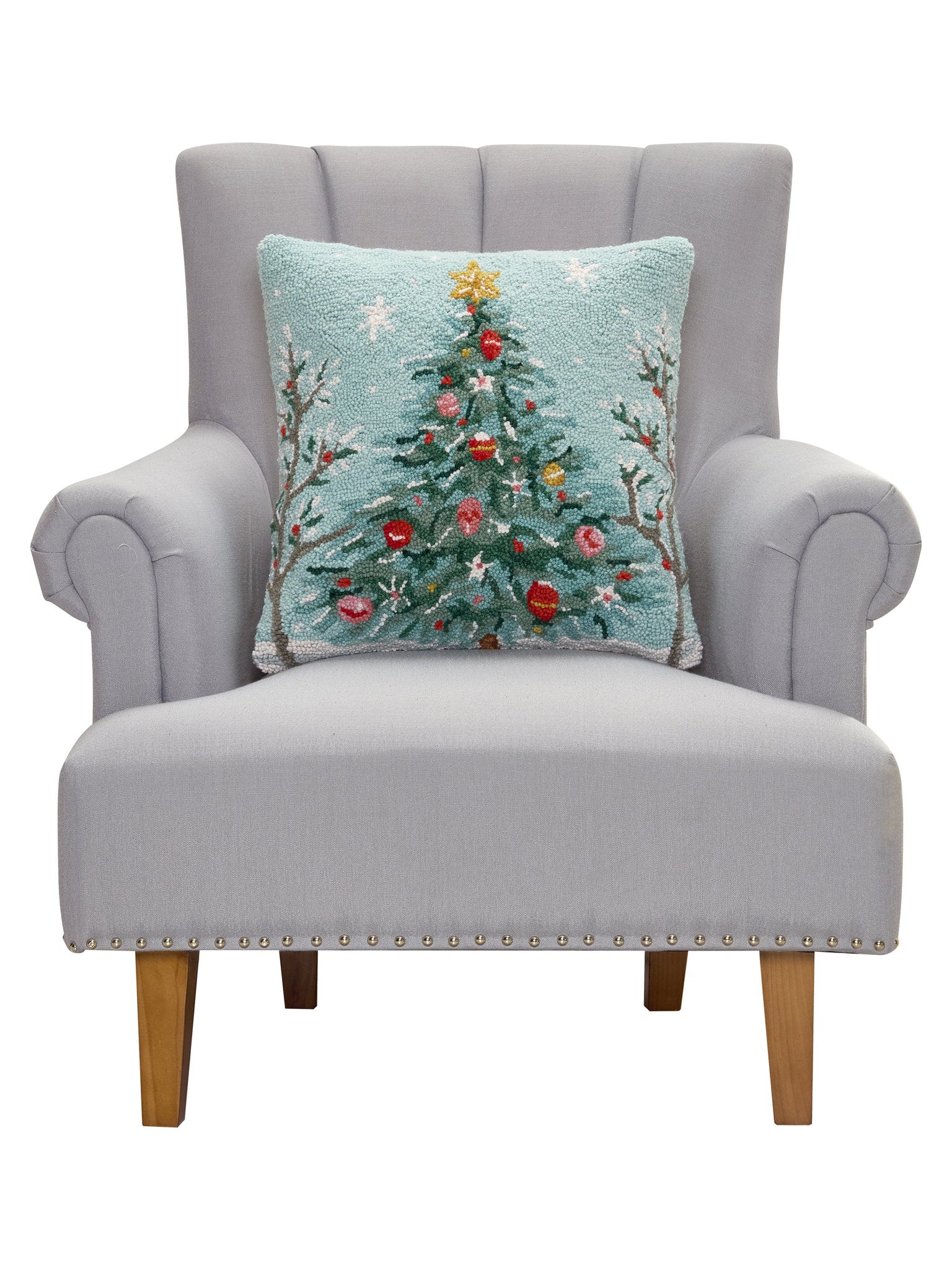 Holiday Christmas Tree Hooked Wool Throw Pillow on an armchair, showing the throw pillow at room scale, 18x18 inch